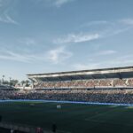 a stadium full of people watching a soccer game