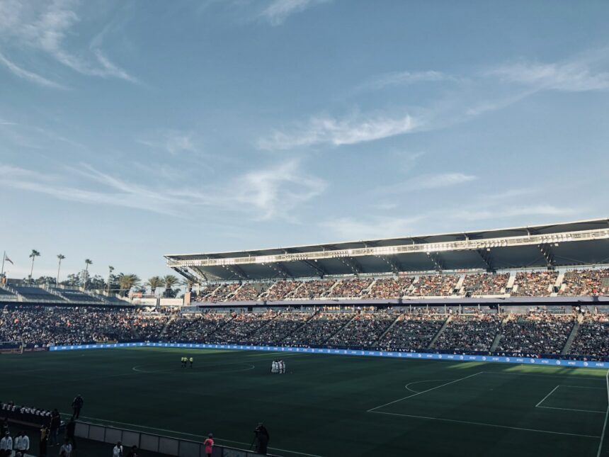 a stadium full of people watching a soccer game